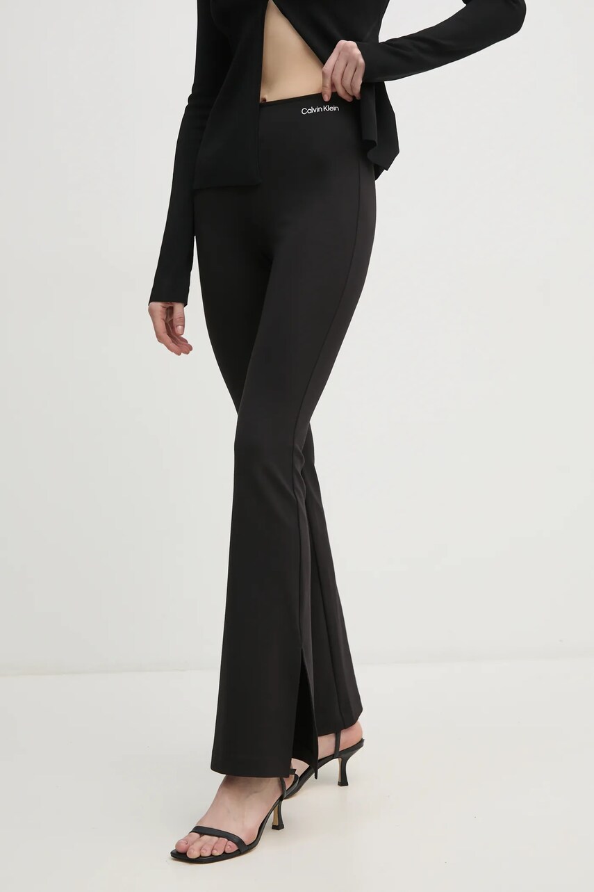 Levně Tepláky Calvin Klein Jeans černá barva, hladké, J20J225089