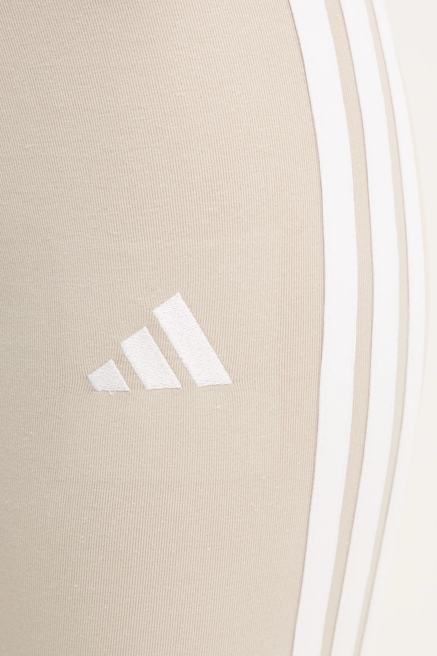 Легінси adidas Essentials жіночі колір бежевий з аплікацією JE0073 
