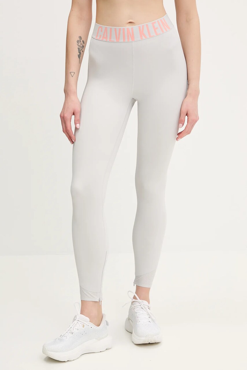 Levně Tréninkové legíny Calvin Klein Performance dámské, šedá barva, s potiskem, LVGWS5L616