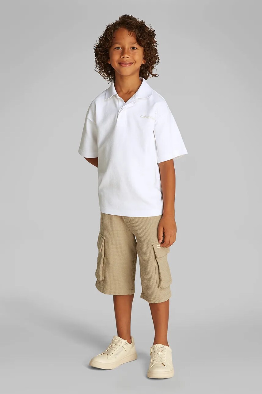 Levně Dětské polo tričko Calvin Klein Jeans černá barva, IB0IB02484