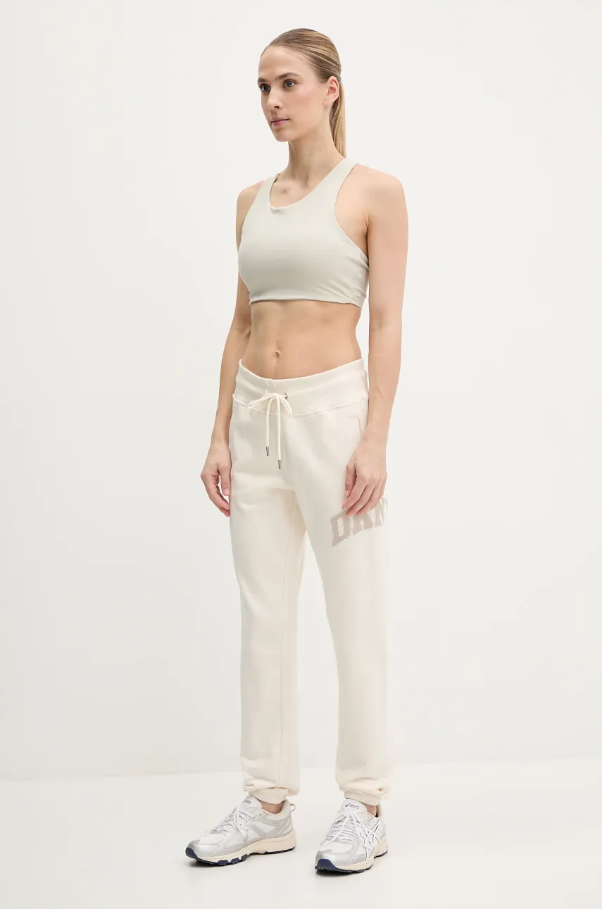 Хлопковые спортивные штаны Dkny женские цвет бежевый с принтом DP5P3615 Хлопковые спортивные штаны Dkny женские цвет бежевый с принтом DP5P3615
