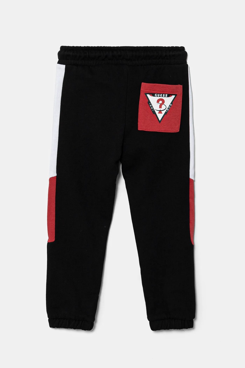 Детские хлопковые штаны Guess цвет чёрный с принтом N5RQ11 KA6R4