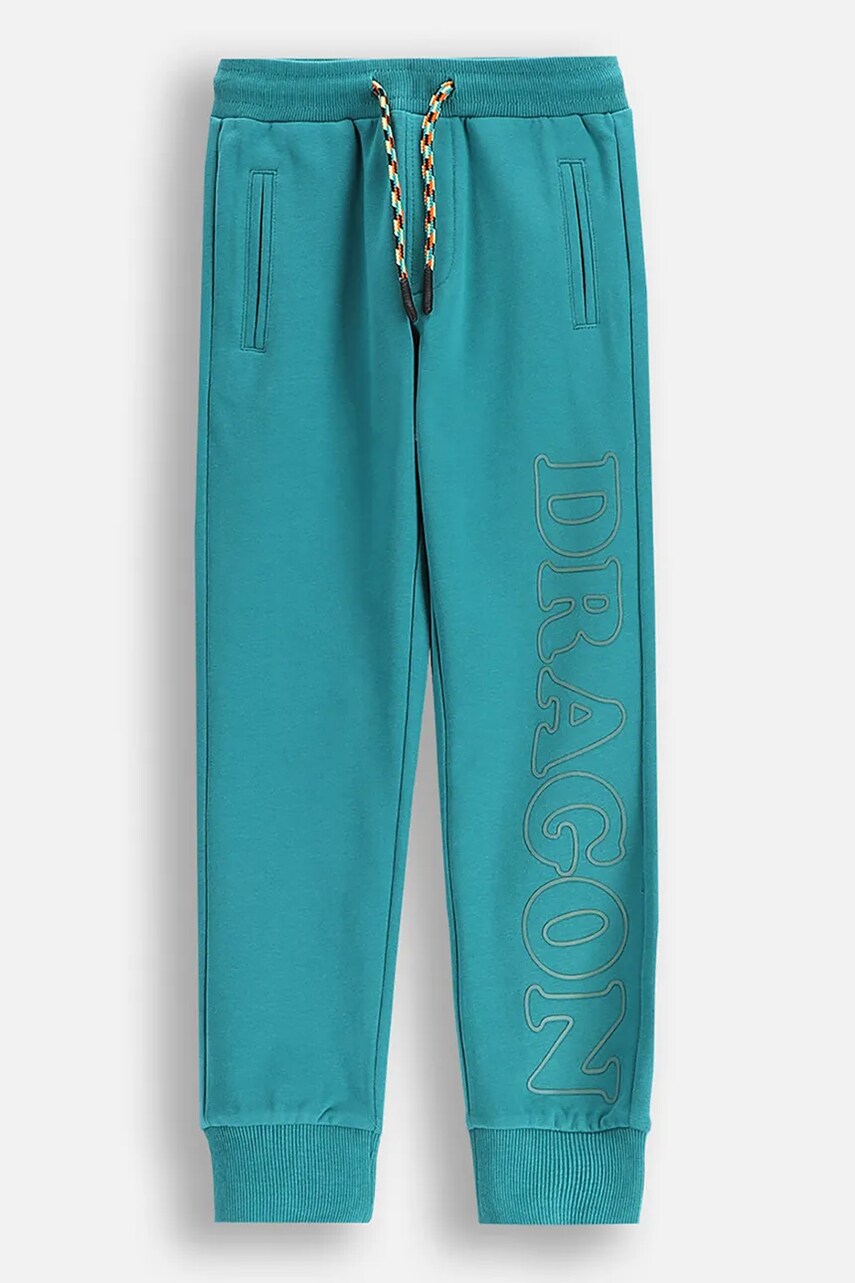 Coccodrillo pantaloni de trening pentru copii culoarea turcoaz, cu imprimeu, DRAGONS BOY KIDS Coccodrillo pantaloni de trening pentru copii culoarea turcoaz, cu imprimeu, DRAGONS BOY KIDS