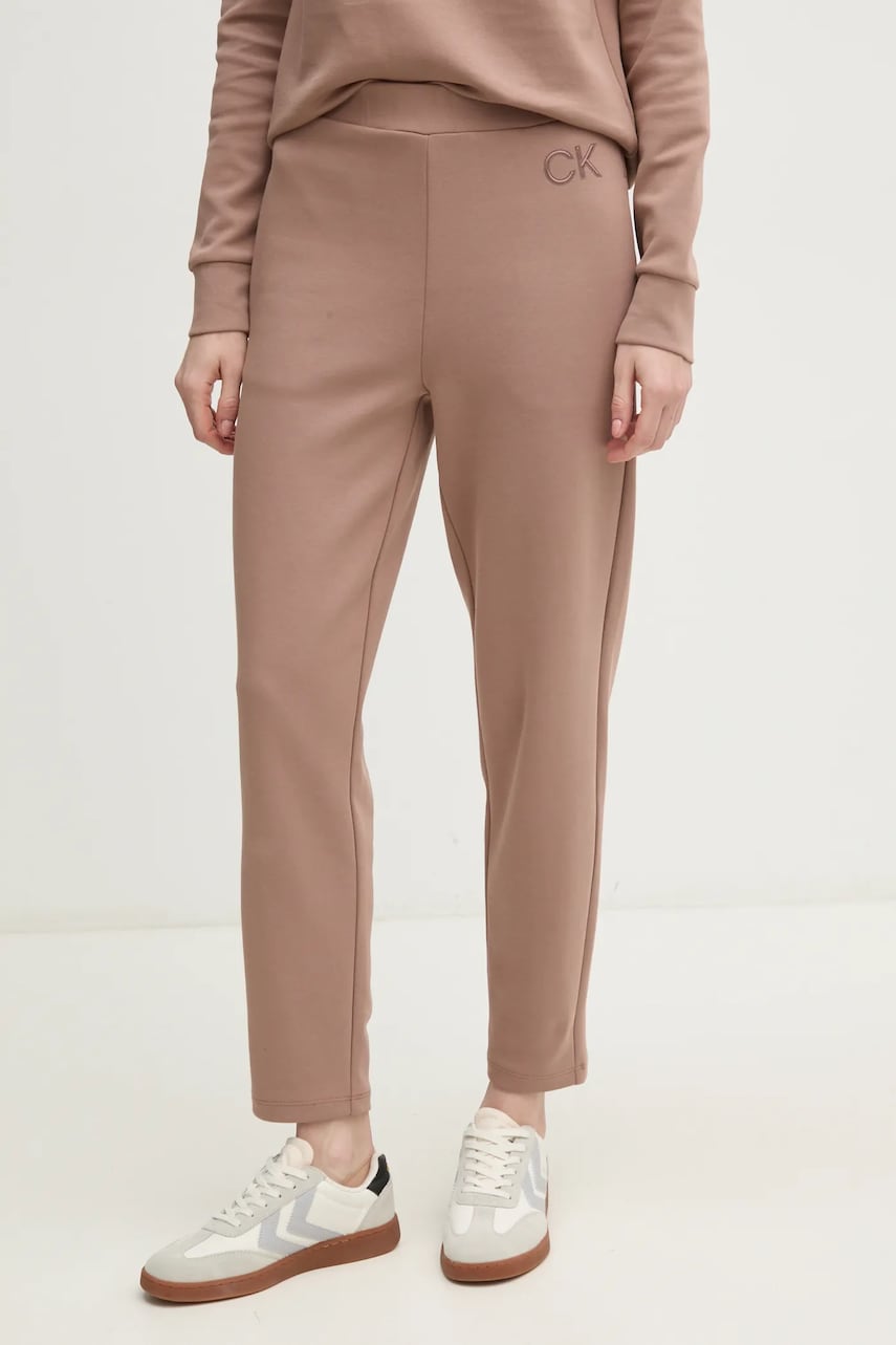 Levně Tepláky Calvin Klein hnědá barva, hladké, K20K207945