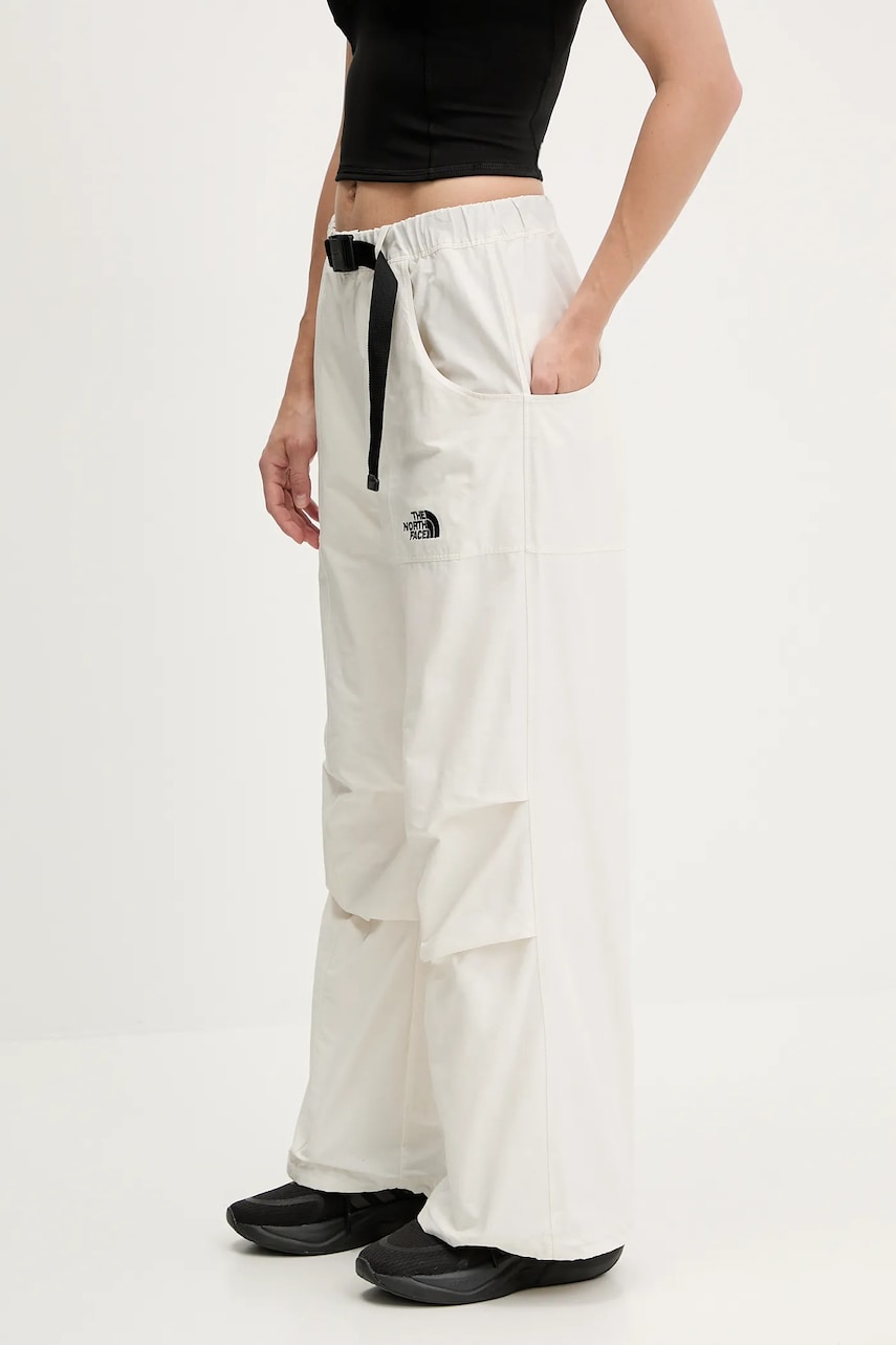 Levně Kalhoty The North Face TNF X NSE dámské, béžová barva, široké, high waist, NF0A8BJHQLI1