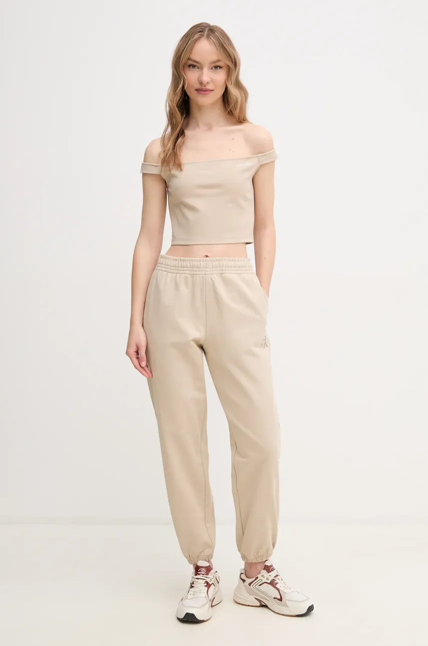Спортивные штаны Calvin Klein Jeans женские цвет бежевый однотонные LV047B235G Спортивные штаны Calvin Klein Jeans женские цвет бежевый однотонные LV047B235G