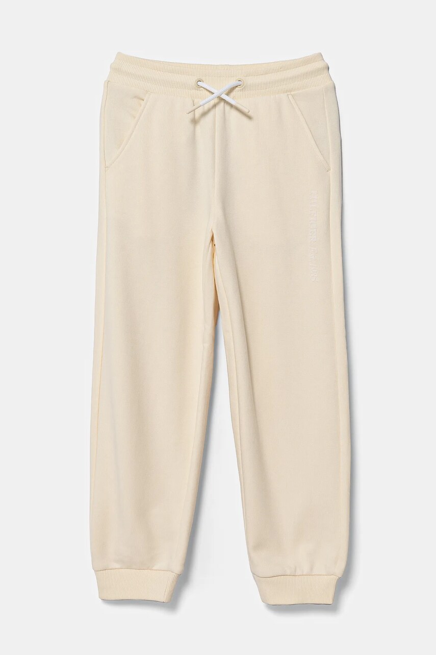 Levně Dětské tepláky Tommy Hilfiger béžová barva, hladké, KG0KG08325