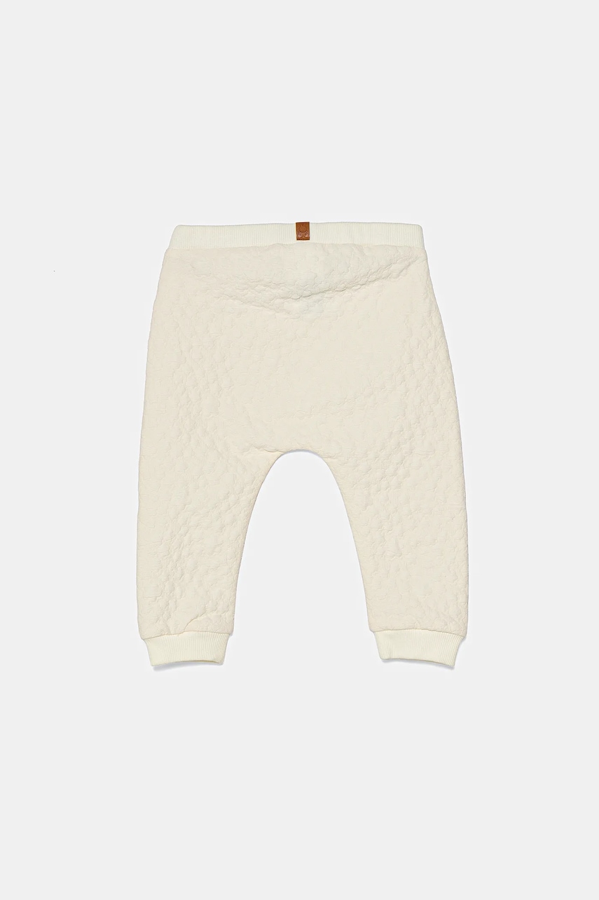 Детские спортивные штаны United Colors of Benetton цвет бежевый с узором 3JEXAF02B Детские спортивные штаны United Colors of Benetton цвет бежевый с узором 3JEXAF02B