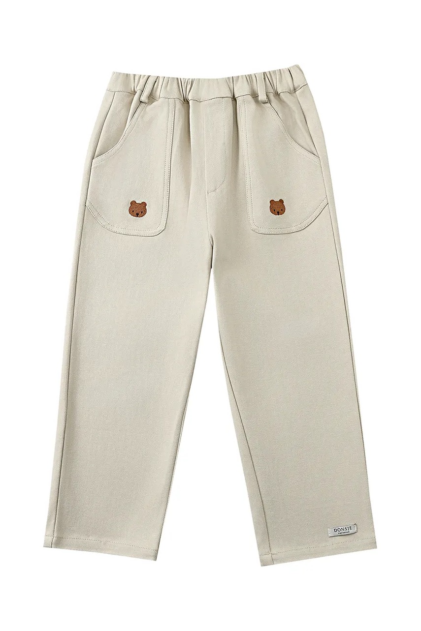 Дитячі бавовняні штанці Donsje Kassim Trousers Bear колір бежевий однотонні 4096301
