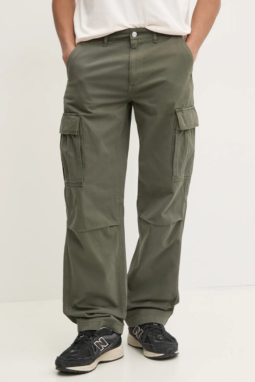 Levně Bavlněné kalhoty Tommy Jeans zelená barva, ve střihu cargo, DM0DM20293