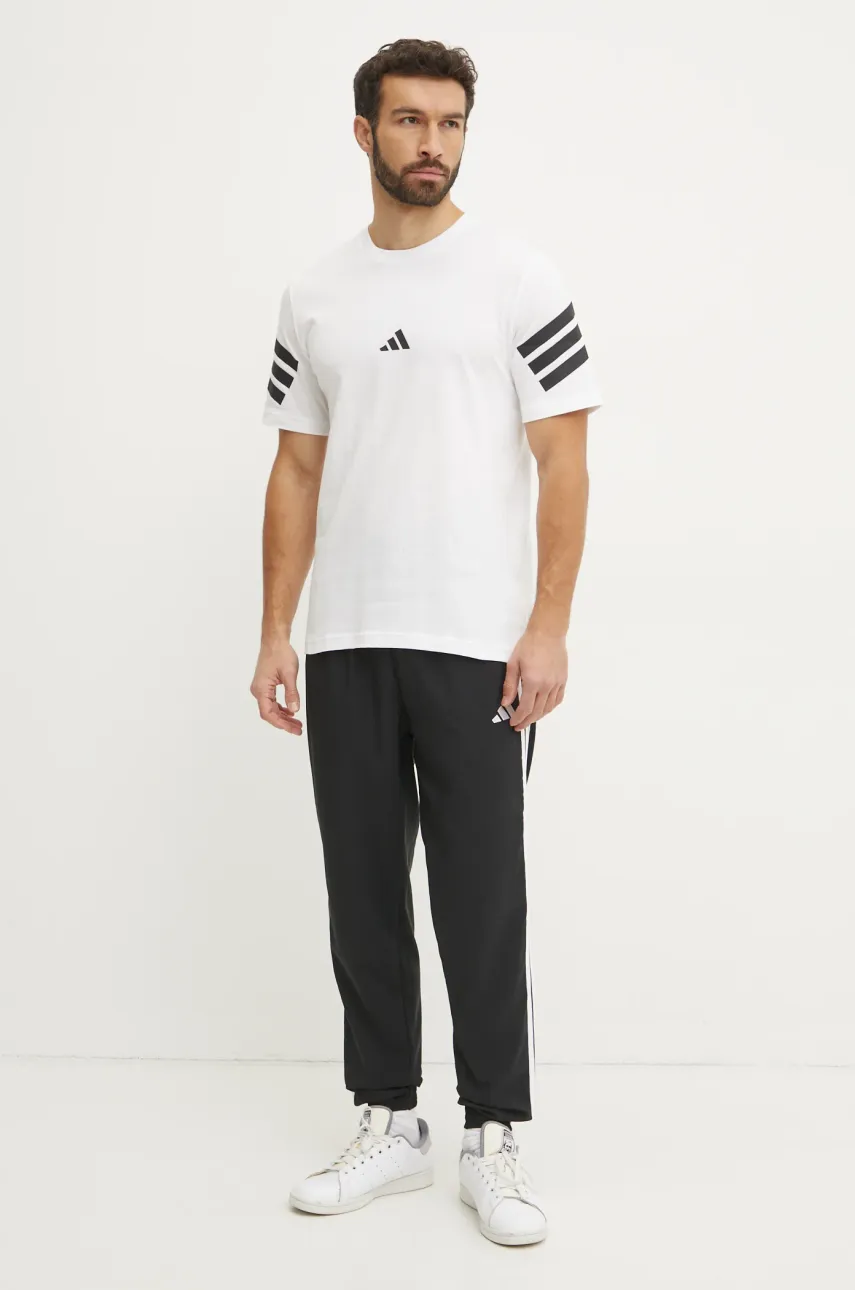 Брюки adidas Essentials мужские цвет чёрный с узором IM7841 Брюки adidas Essentials мужские цвет чёрный с узором IM7841