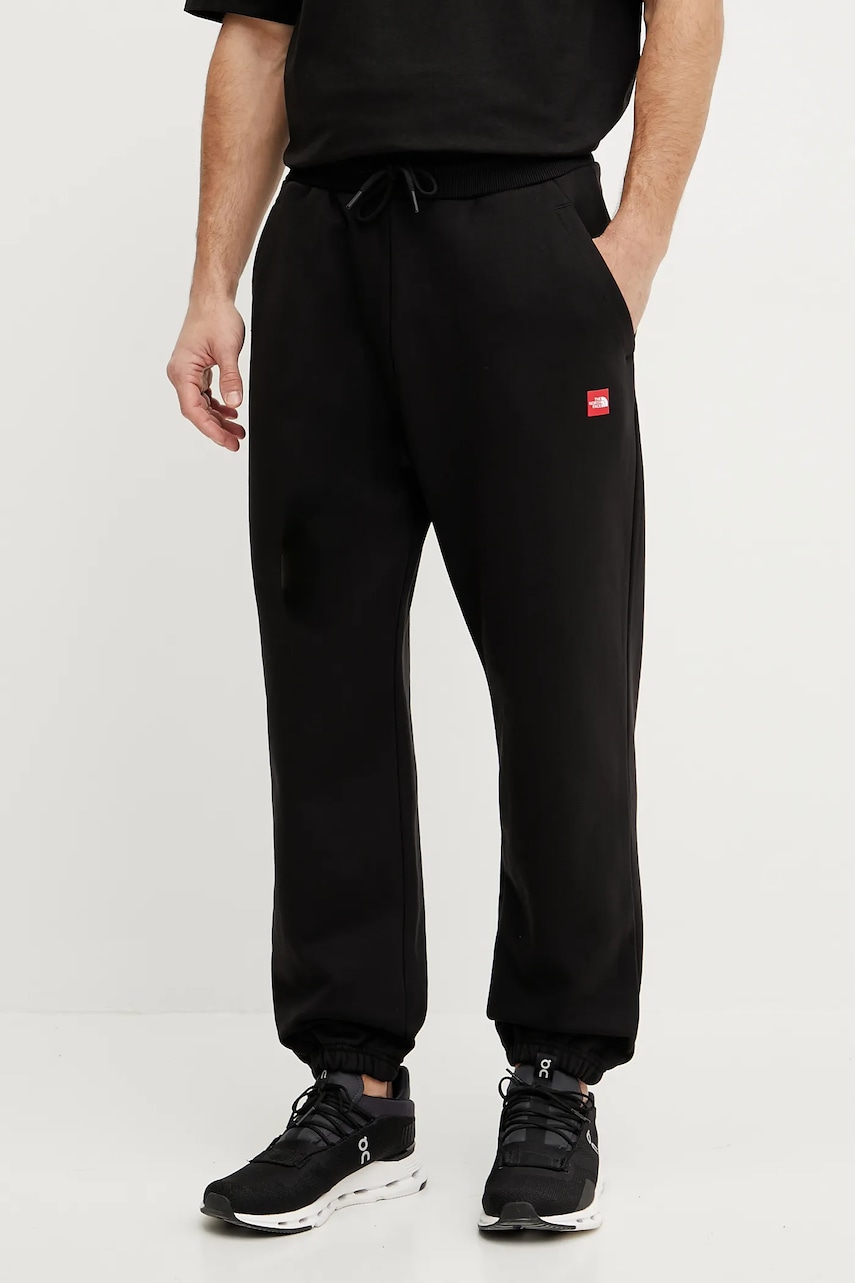 The North Face pantaloni de trening din bumbac Axys barbati, culoarea negru, neted, NF0A8C1UJK31 The North Face pantaloni de trening din bumbac Axys barbati, culoarea negru, neted, NF0A8C1UJK31
