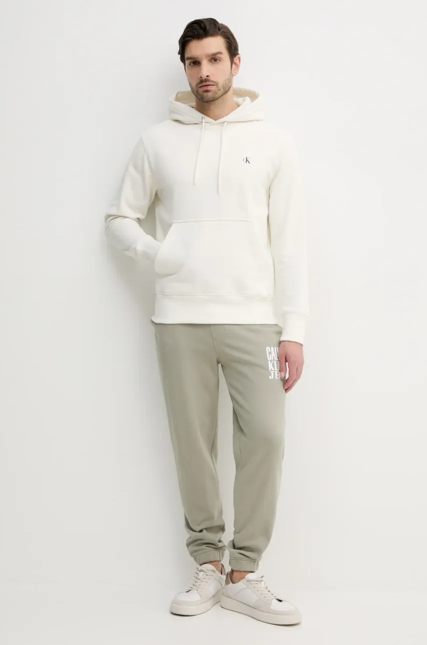 Хлопковые спортивные штаны Calvin Klein Jeans мужские цвет бежевый с принтом J30J327535 Хлопковые спортивные штаны Calvin Klein Jeans мужские цвет бежевый с принтом J30J327535