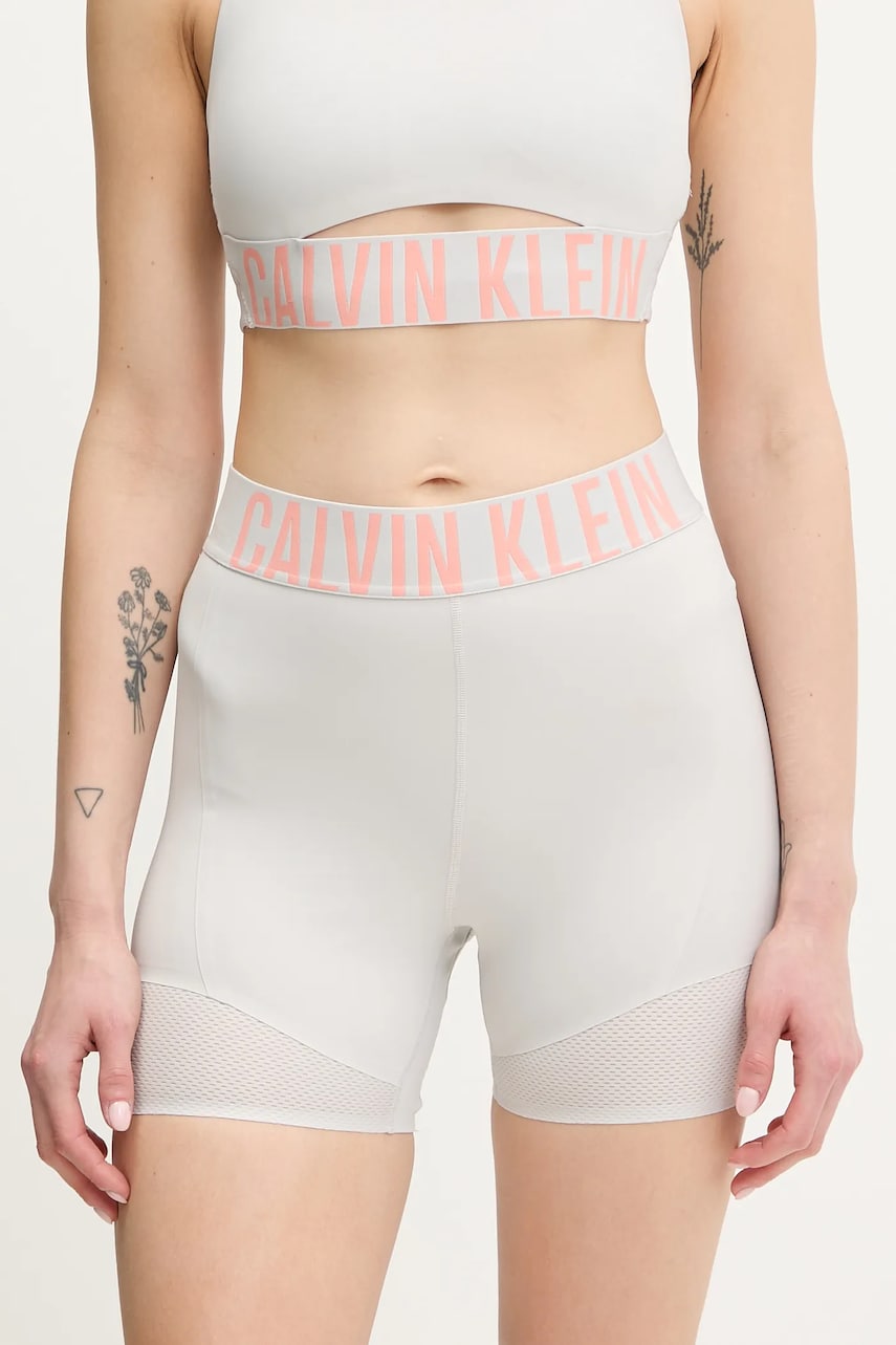 Levně Tréninkové šortky Calvin Klein Performance dámské, šedá barva, s potiskem, high waist, LVGWS5L704
