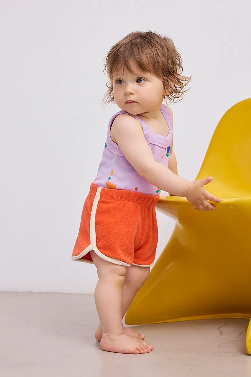 Bobo Choses pantaloni scurți din bumbac pentru bebeluși culoarea portocaliu, neted, 125AB043 Bobo Choses pantaloni scurți din bumbac pentru bebeluși culoarea portocaliu, neted, 125AB043