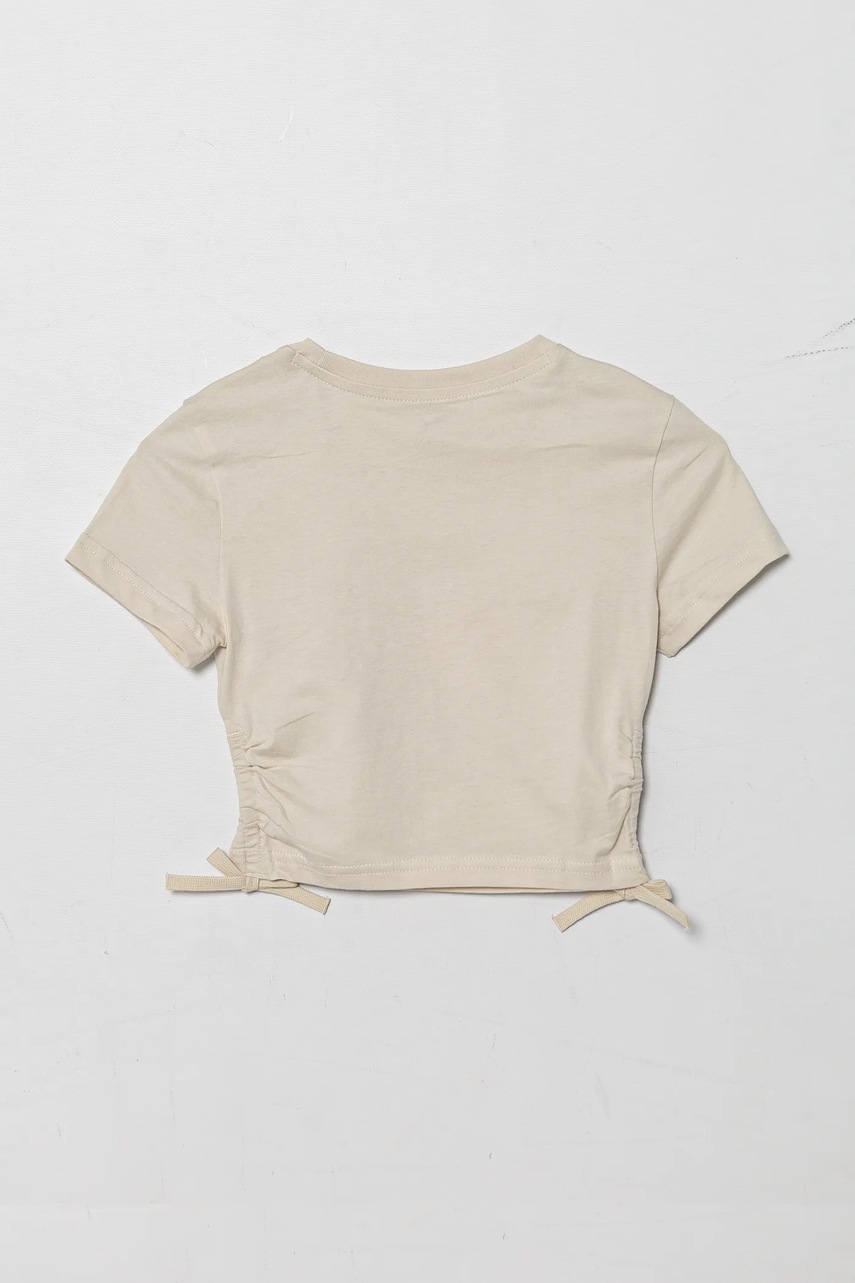 Детская хлопковая футболка Puma FLAMING LOVE Knotted Tee цвет бежевый 685108