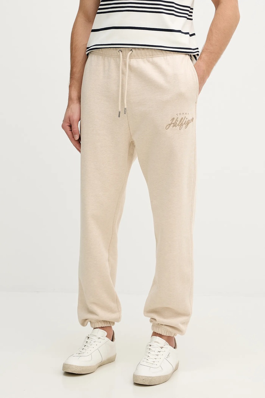 Levně Bavlněné tepláky Tommy Hilfiger pánské, béžová barva, MW0MW42537