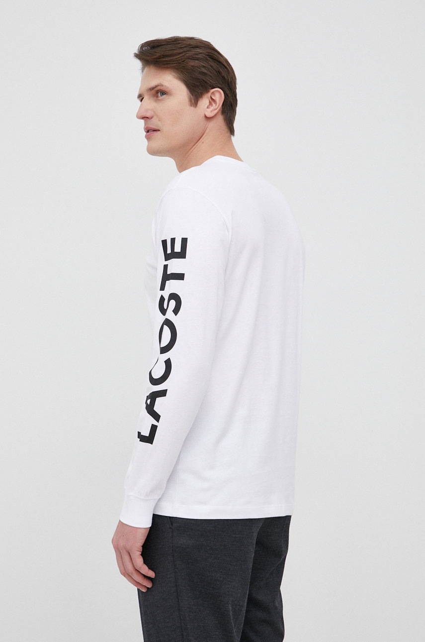 

Бавовняний лонгслів Lacoste колір білий з принтом