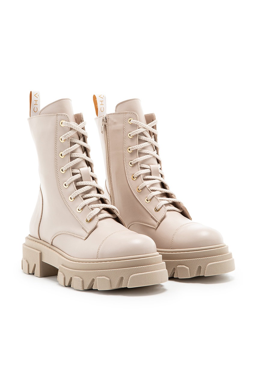 

Кожаные полусапоги Charles Footwear женские цвет бежевый на платформе